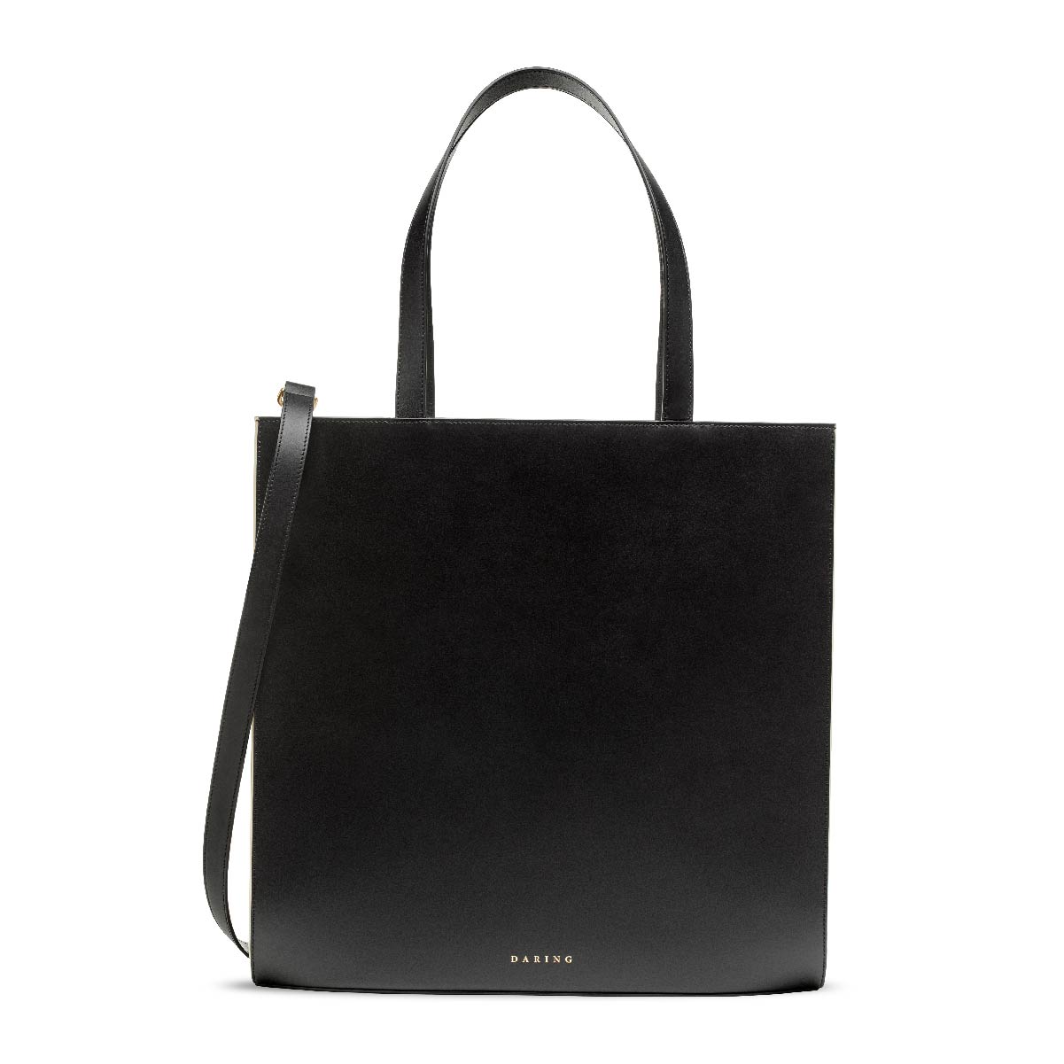 The Tote in Black + Cream, with removable strap and top handles, front view.